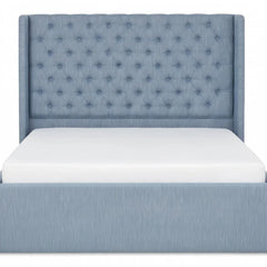 Front view of the light blue tufted upholstered storage bed frame with high diamond-tufted headboard and white mattress
