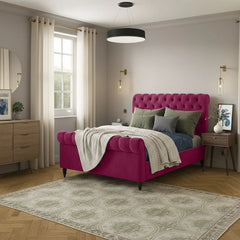 Modern bedroom with a pink bed and decorative pillows.