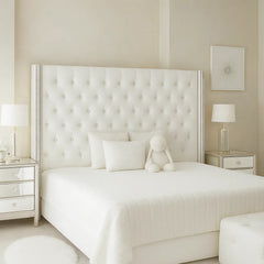 Serenity Royale Storage Bed in white with luxury tufted wingback headboard, crystal button detailing, and elegant mirrored nightstands in a bright modern bedroom