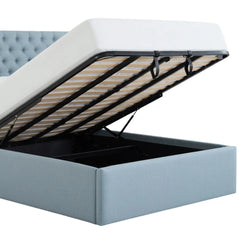 Clean front view of the light blue tufted upholstered storage bed frame with high headboard and visible wooden slats