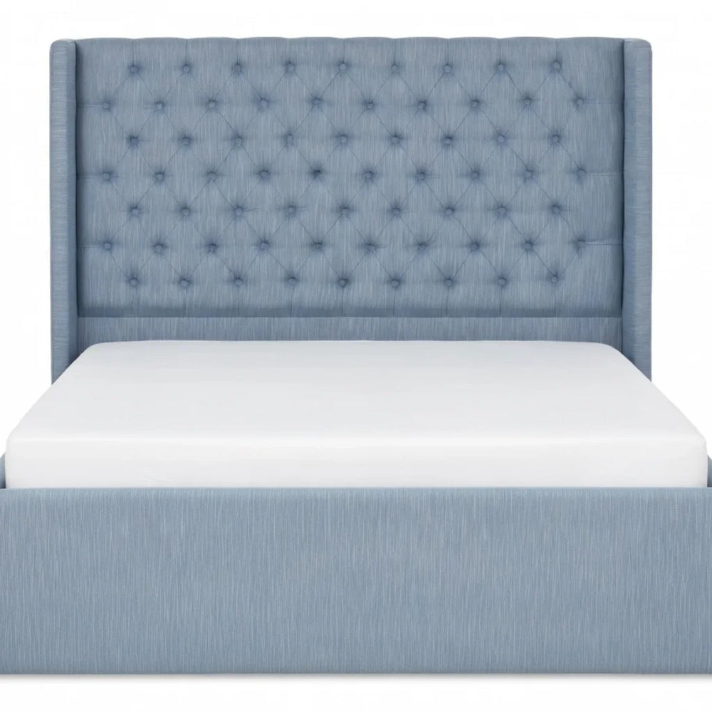 Front view of the light blue tufted upholstered storage bed frame with high diamond-tufted headboard and white mattress