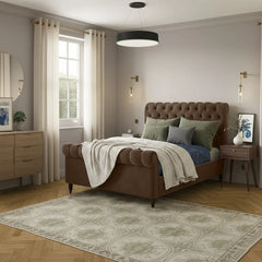 Neatly arranged bedroom with a brown upholstered bed, wooden nightstands, and decorative elements.