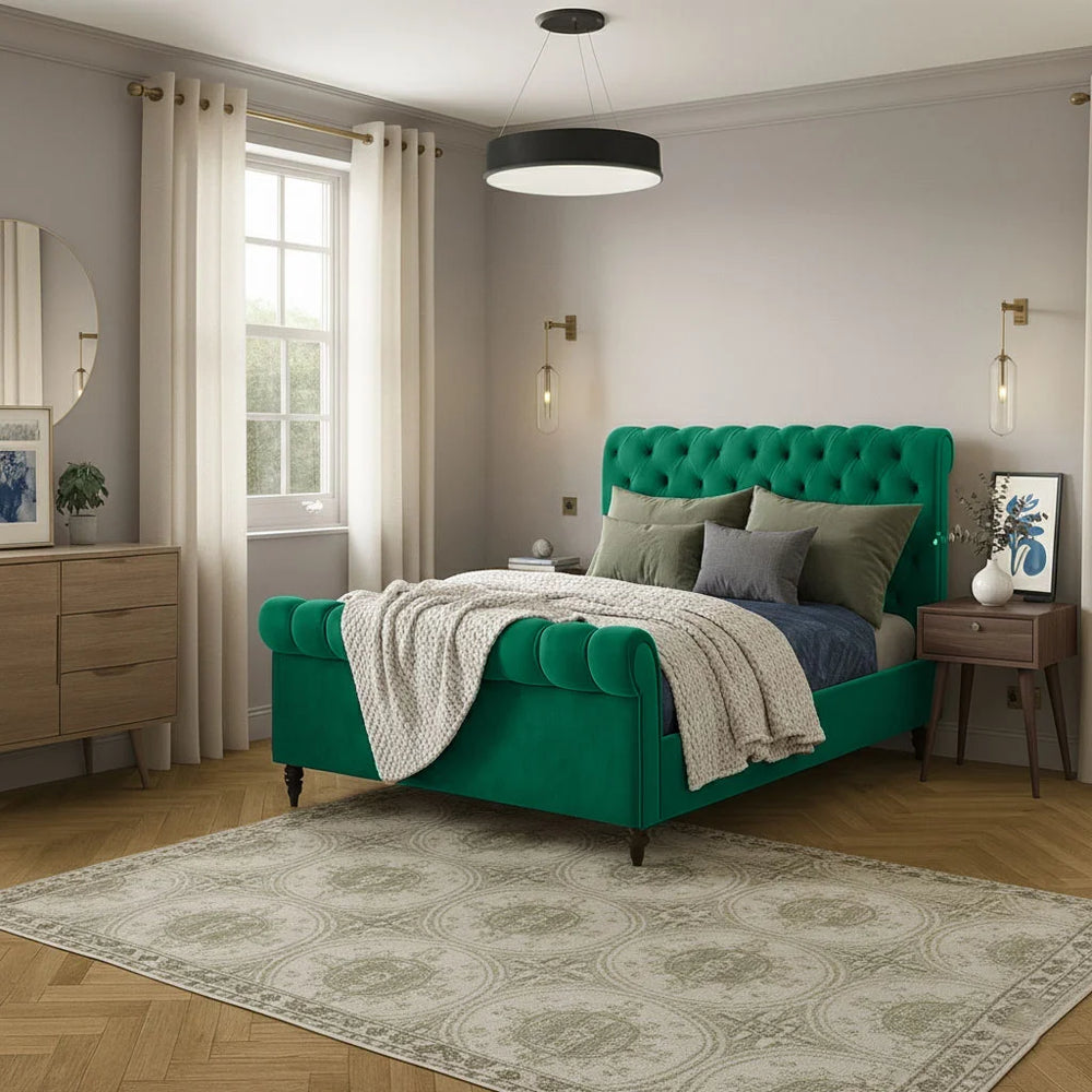 Modern bedroom with a green upholstered bed and decorative elements.