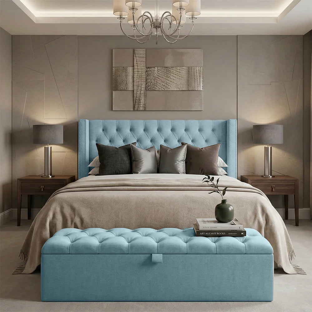 Modern bedroom with a blue upholstered bed and matching bench.
