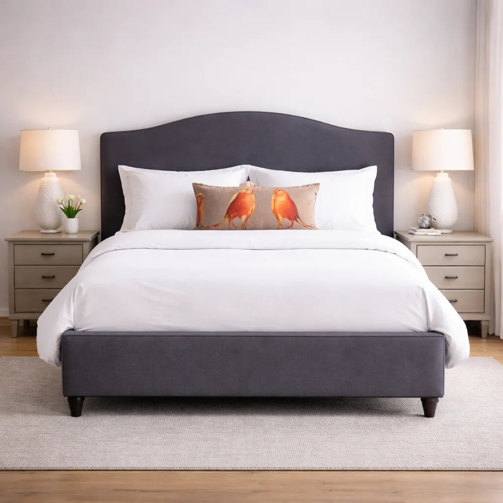 Modern Curved Headboard Upholstered Bed Frame in grey with white bedding and decorative bird pillow